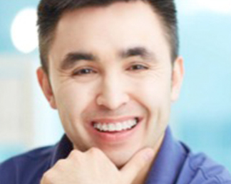 adult wearing clear ceramic braces in london | Whites Dental