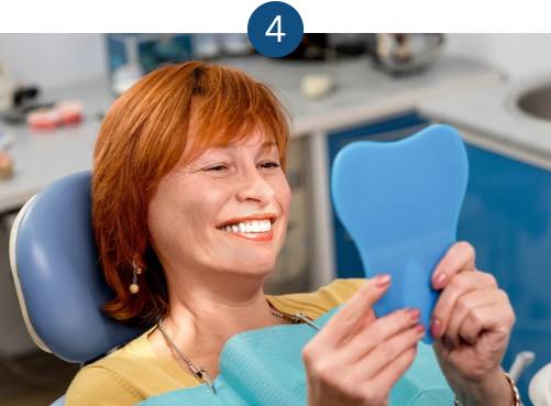 Denture patient at a post fit care appointment at our London clinic