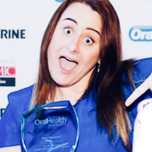 Sarah Elliston winning an award for best hygienist in London